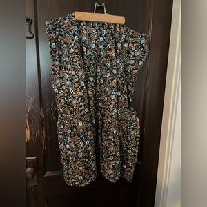 Never worn Whimsical Floral Skirt with front slit, pockets and buttons.